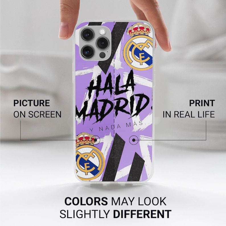 May include: A light purple phone case featuring the Real Madrid soccer club logo at the top and bottom, with black diagonal stripes and the text "HALA MADRID Y NADA M&Aacute;S" printed in a bold, black, brush-stroke style font across the center.