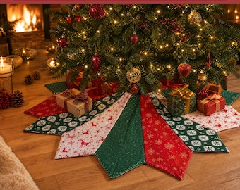 May include: A star-shaped Christmas tree skirt featuring alternating panels of red, dark green, and white fabric with festive patterns including reindeer and snowflakes. The skirt is displayed under a decorated Christmas tree with gifts.