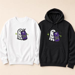 May include: A white crewneck sweatshirt and a black hooded sweatshirt, each featuring an embroidered graphic of a white ghost holding a purple can with a skull icon and the text custom name, accented by small green stars and a black bat.