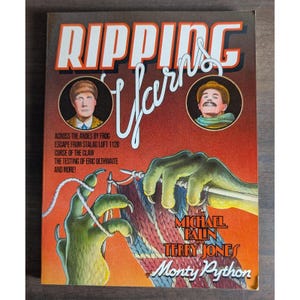 May include: A book titled Ripping Yarns by Michael Palin and Terry Jones of Monty Python. The cover features a red and orange gradient background, two circular portraits of men, and a green clawed hand knitting a Union Jack patterned fabric.