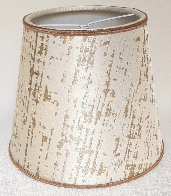 white and gold light shade