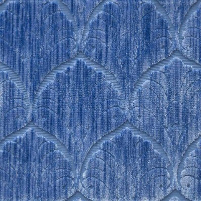 May include: Blue fabric with a textured, embossed pattern of repeating leaf shapes.