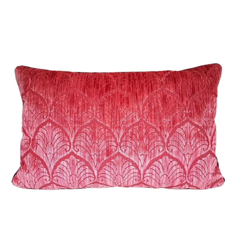 May include: A red velvet pillow with a white damask pattern. The pillow has a black trim.