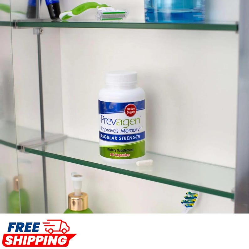 May include: A white plastic bottle of Prevagen dietary supplement with a blue and green label that reads Prevagen Improves Memory Regular Strength 60 Day Supply 30 Capsules. A single white capsule sits on the glass shelf in front of the bottle.
