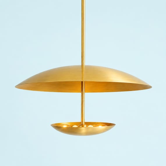 A hand-assembled brass Sputnik chandelier that looks like it teleported straight out of a 1959 Italian design atelier — the kind of fixture that makes a room.