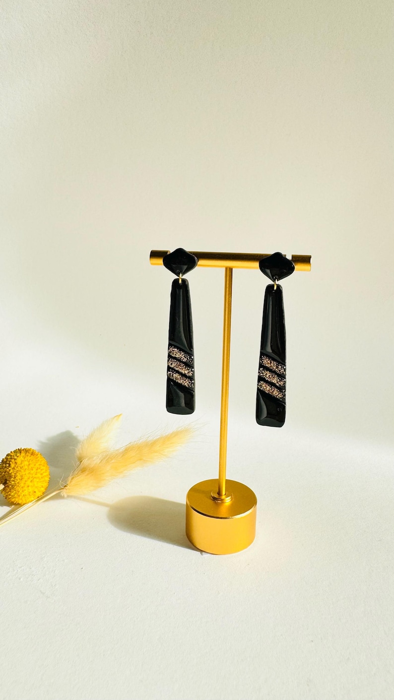 Modern geometric black and gold statement dangle earrings