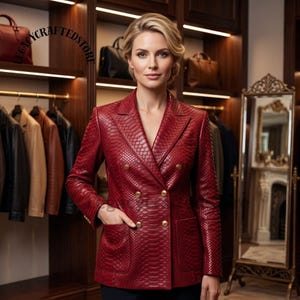 May include: A double-breasted blazer in deep red with a textured snakeskin pattern, featuring gold-toned buttons, notched lapels, and two front patch pockets. The garment is displayed in a closet setting with the text LEGACYCRAFTEDSTORE visible.