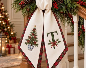 May include: A cream-colored fabric stair runner featuring a red and green plaid border. The left panel displays an embroidered Christmas tree in a blue and white pot, while the right panel features a large green letter T with holly accents.