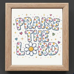 May include: A framed cross-stitch embroidery featuring the text PRAISE THE LORD in block letters filled with colorful polka dots. The letter O is replaced by a white daisy with a yellow center, surrounded by small hearts and star icons.