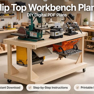 May include: A light-colored wooden flip top workbench with a rotating mechanism, featuring a yellow planer and an orange thickness planer mounted underneath. The top surface holds a green belt sander, a gray sharpener, and a metal grinder.