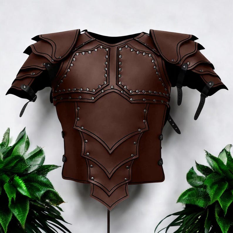 May include: A brown chest armor piece featuring layered shoulder pauldrons and a segmented torso plate. The armor is constructed with multiple overlapping panels, secured by rows of small silver-toned metal rivets along the edges and seams.