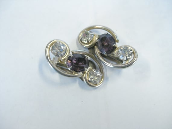 Vintage Mid-Century Goldtone Scrolled Clip Earrings with Clear and Amethyst Colored Glass Cut Stones