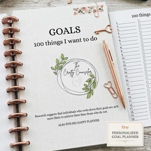 May include: A disc-bound goal planner with copper-colored discs, featuring the text GOALS 100 things I want to do, a logo for The Crafty Counselor with green leaves, and a rose gold pen. The page includes a numbered list and motivational text.