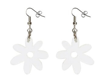 May include: A pair of silver dangle earrings with clear acrylic flower charms. The flowers have a simple, rounded design with a hole in the center.