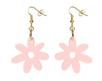 May include: A pair of gold dangle earrings with pink flower-shaped charms. The flowers have a small hole in the center.