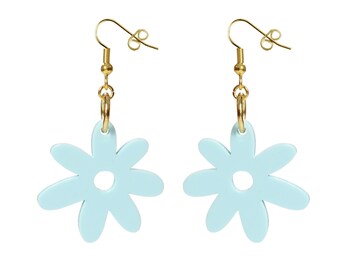 May include: A pair of light blue flower-shaped dangle earrings with gold hooks.