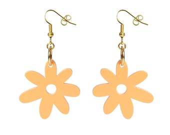 May include: A pair of peach-colored flower-shaped dangle earrings with gold-toned hooks.