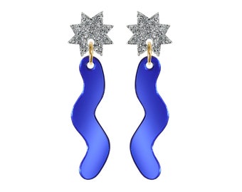 May include: A pair of blue, wavy, abstract earrings with silver glitter star accents.