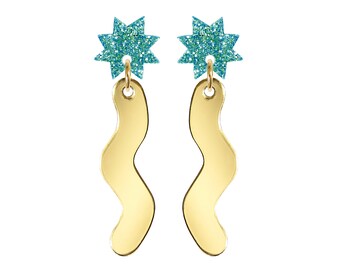 May include: Gold earrings with a wavy design and a turquoise glitter star charm.