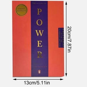 May include: The 48 Laws of Power book with a red cover and a central purple vertical stripe featuring gold text. It measures 7.87 inches in height and 5.11 inches in width. A gold National Bestseller seal is visible, along with the author's name.