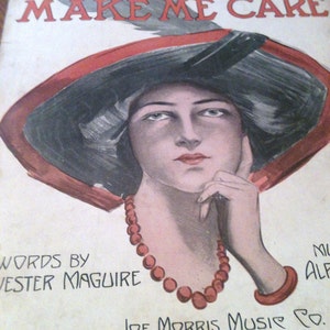 May include: A vintage sheet music cover featuring a woman wearing a large black hat with a red brim. The title of the song is "Why Did You Make Me Care" and the words are by Jester Maguire. The music is published by Joe Morris Music Co. in New York.