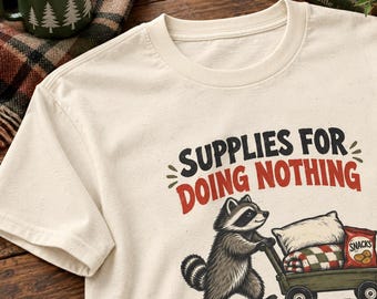 Raccoon Pushing a Snack Wagon Graphic Tee