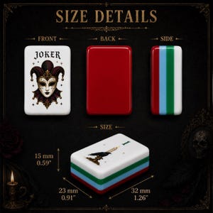 May include: A rectangular game tile featuring a Joker mask illustration on the front, a solid red back, and a side with red, blue, and green stripes. The tile measures 15 mm (0.59 inches) by 23 mm (0.91 inches) by 32 mm (1.26 inches) in size.