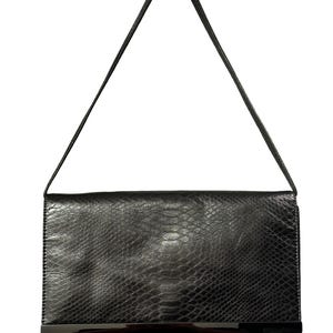 May include: A black rectangular shoulder bag featuring a textured snakeskin pattern. The bag has a single thin shoulder strap and a horizontal metallic bar accent across the lower front section, providing a sleek and structured appearance.