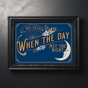 May include: A framed art print with the text "ALL WAS GOLDEN WHEN THE DAY MET THE NIGHT" in gold and white lettering. The artwork features a blue background, a crescent moon, and floral accents, all within a black ornate frame.