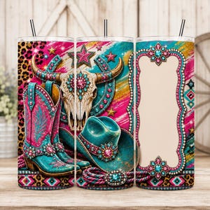 May include: A cylindrical tumbler with a straw featuring a vibrant design of a cow skull, turquoise cowboy boots, and a matching hat. The pattern includes pink and turquoise accents, leopard print, and a central blank frame for personalization.