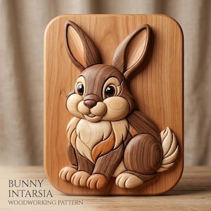 May include: A wooden intarsia wall plaque featuring a three-dimensional rabbit design. The artwork is crafted from various shades of natural wood, showcasing light and dark grain patterns. The bunny has large ears, a rounded face, and a fluffy tail.
