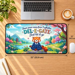 May include: A rectangular desk mat measuring 22 inches by 12 inches, featuring a red panda in a blue suit meditating on a rock. The text reads: Inner peace comes from 3 syllables: DEL-E-GATE Just let it go. The background shows a colorful landscape.