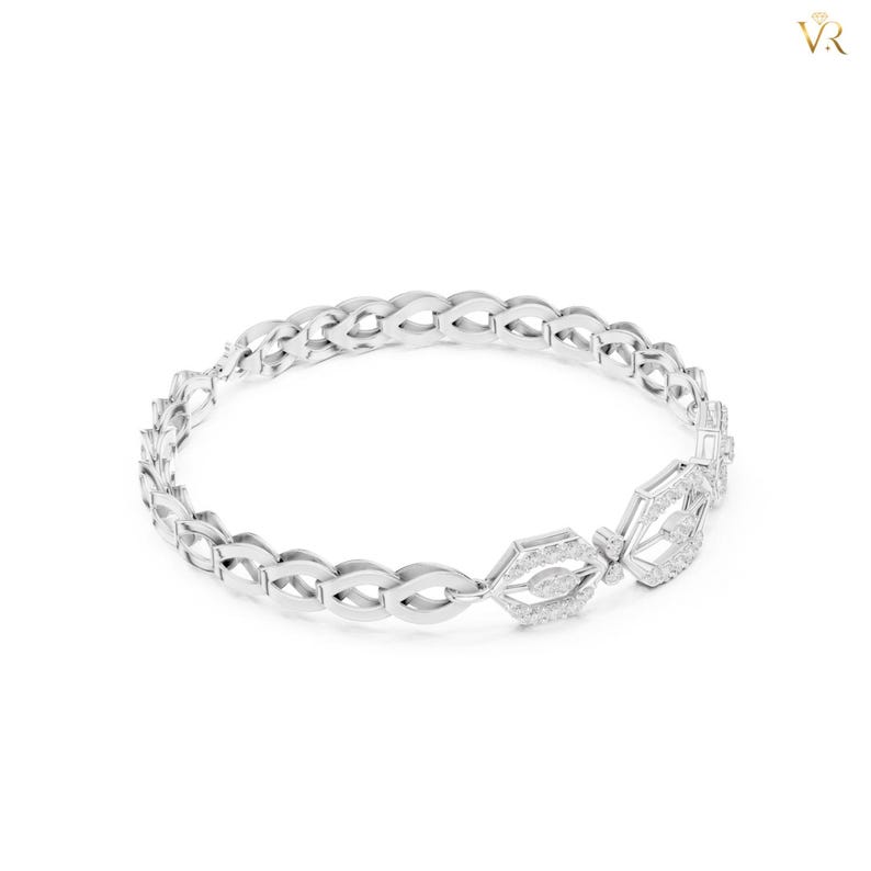 May include: A silver-toned bangle bracelet featuring a repeating openwork link pattern. The design includes two prominent hexagonal-shaped links encrusted with small, clear, sparkling stones, creating a continuous circular structure.