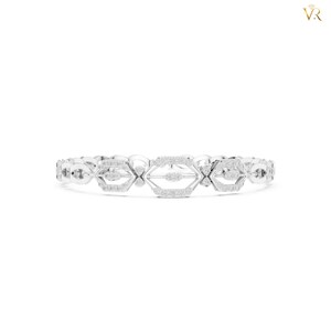 May include: A silver-toned bracelet featuring a series of interconnected geometric links. Each link is shaped like an elongated hexagon with a central horizontal bar, and the entire surface is encrusted with small, clear, sparkling stones.