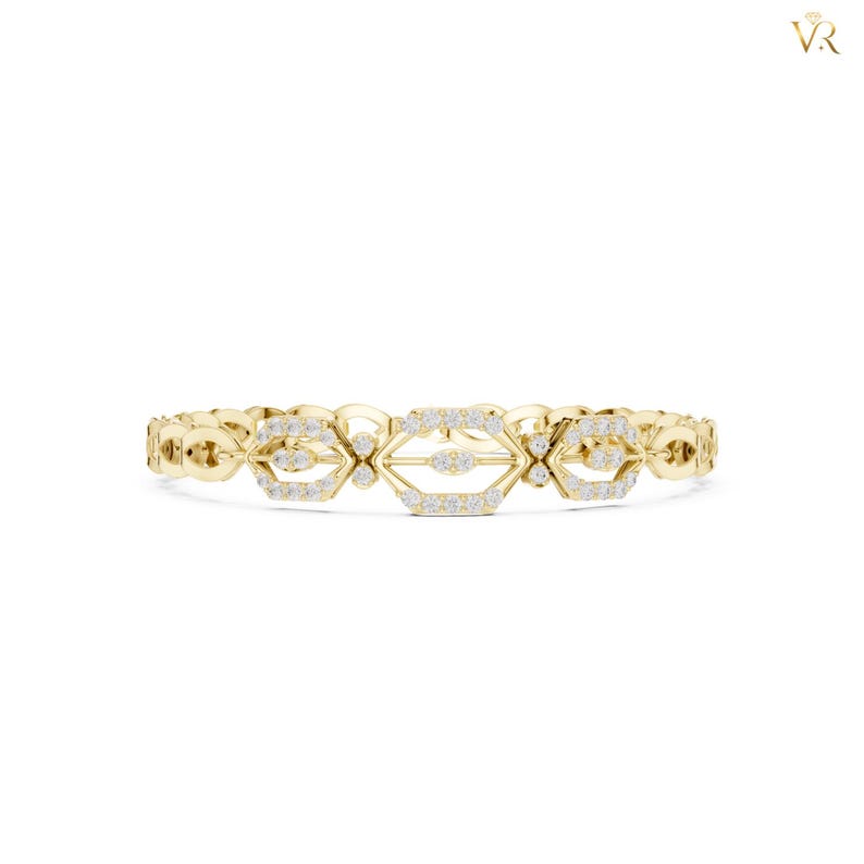 May include: A yellow gold bracelet featuring a series of repeating geometric links. Each link is shaped like an elongated hexagon and is encrusted with small, clear, round-cut stones. The metal has a polished finish, creating a reflective surface.