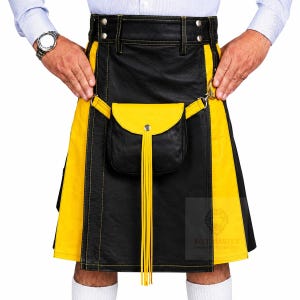 May include: A black and yellow kilt featuring a high waistband with belt loops, a central detachable pouch with a yellow flap, and long yellow fringe tassels. The garment is constructed with visible yellow stitching and metal hardware accents.