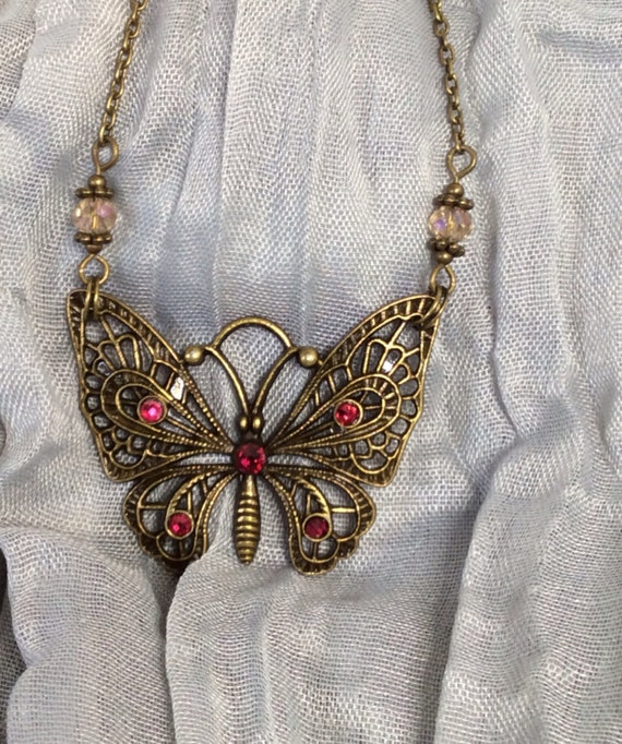 Items similar to Bronze butterfly necklace with free shipping on Etsy