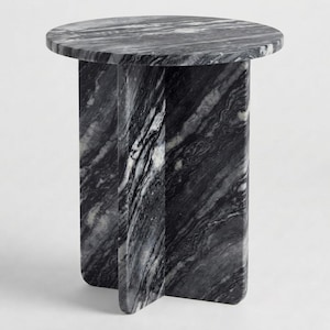 May include: A round side table crafted from black and white veined marble. The table features a circular top surface supported by a base composed of two intersecting vertical panels that form a cross-shaped structure, showcasing natural stone patterns.