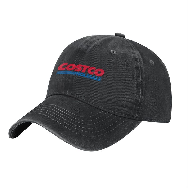 May include: A black baseball cap with a distressed, washed-out finish. The front features the red and blue Costco Wholesale logo embroidered in the center. The cap has a curved brim with visible stitching and a button on the top crown.