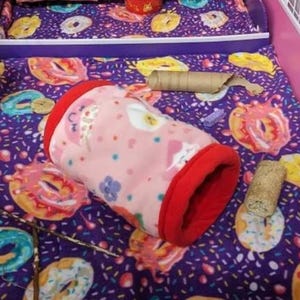Give your small pets the cozy hideaway they deserve with this Guinea Pig Tunnel Bed, designed for comfort, play, and stress-free snuggling. This soft tunnel creates the perfect safe space. This washable small animal hideout is ideal for guinea pigs, hedgehogs, ferrets, chinchillas, and other small pets.
Features reinforced, structured openings on both ends to help it stay open, making it easy for your pets to enter, exit, and explore. It’s perfect for playtime or nap time.