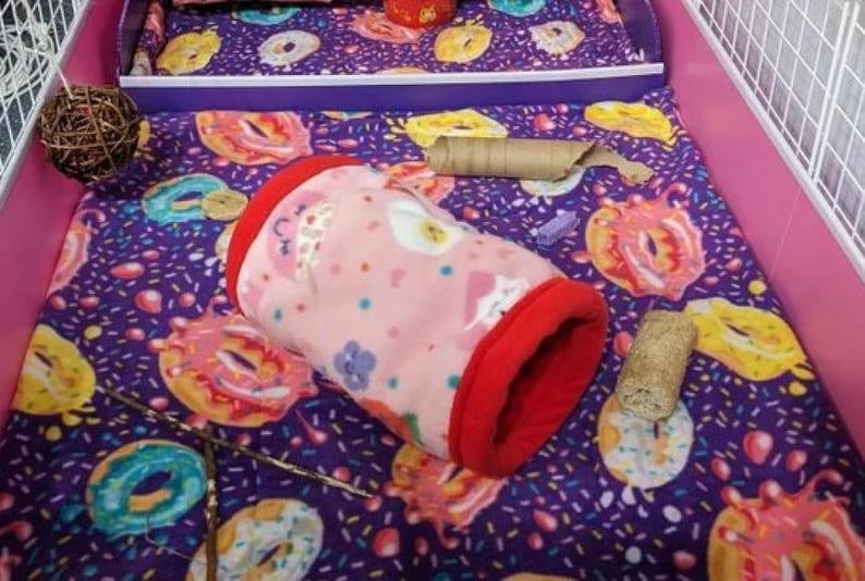 Give your small pets the cozy hideaway they deserve with this Guinea Pig Tunnel Bed, designed for comfort, play, and stress-free snuggling. This soft tunnel creates the perfect safe space. This washable small animal hideout is ideal for guinea pigs, hedgehogs, ferrets, chinchillas, and other small pets.
Features reinforced, structured openings on both ends to help it stay open, making it easy for your pets to enter, exit, and explore. It’s perfect for playtime or nap time.