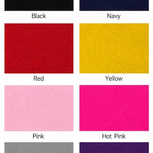 May include: A grid of eight rectangular felt fabric swatches in solid colors labeled Black, Navy, Red, Yellow, Pink, Hot Pink, Gray, and Purple. Each swatch displays a uniform, textured surface characteristic of felt material.