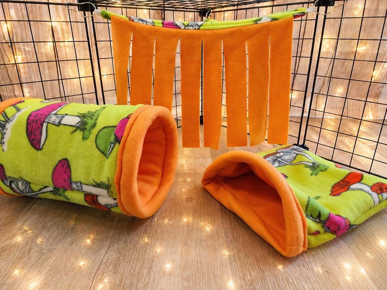 Give your small pets the cozy hideaway they deserve with this Guinea Pig Tunnel Bed, designed for comfort, play, and stress-free snuggling. This soft tunnel creates the perfect safe space. This washable small animal hideout is ideal for guinea pigs, hedgehogs, ferrets, chinchillas, and other small pets.
Features reinforced, structured openings on both ends to help it stay open, making it easy for your pets to enter, exit, and explore. It’s perfect for playtime or nap time.