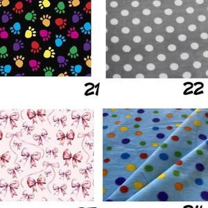 May include: A four-panel grid of fabric swatches. Panel 21 features multicolored paw prints on a black background. Panel 22 shows white polka dots on a gray background. Panel 23 displays pink bows on a light pink background. Panel 24 has multicolored dots on a light blue background.