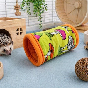Give your small pets the cozy hideaway they deserve with this Guinea Pig Tunnel Bed, designed for comfort, play, and stress-free snuggling. This soft tunnel creates the perfect safe space. This washable small animal hideout is ideal for guinea pigs, hedgehogs, ferrets, chinchillas, and other small pets.
Features reinforced, structured openings on both ends to help it stay open, making it easy for your pets to enter, exit, and explore. It’s perfect for playtime or nap time.
