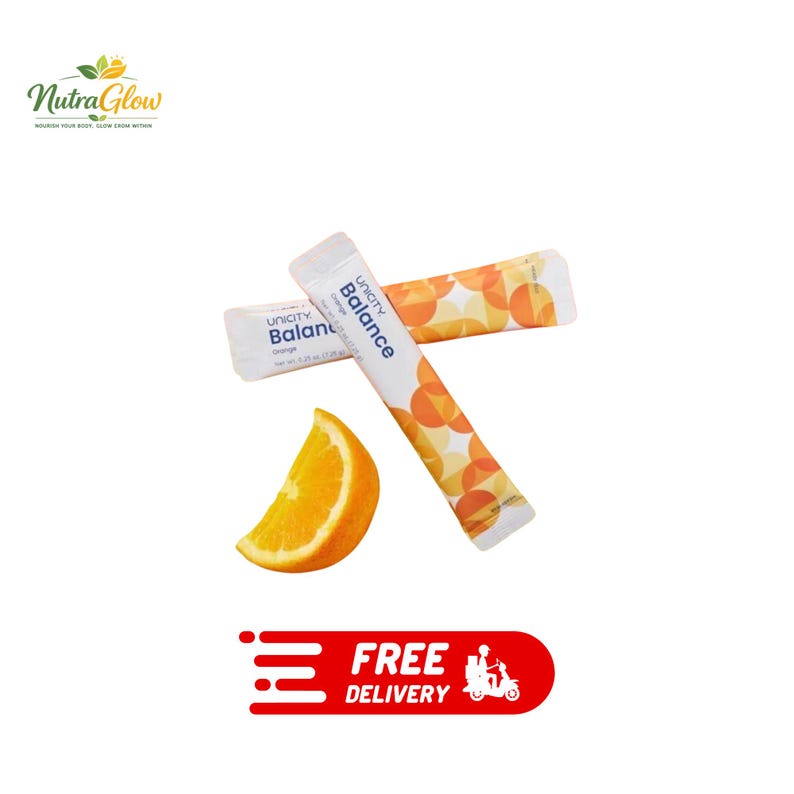 May include: Two white Unicity Balance Orange dietary supplement stick packs featuring a geometric orange circle pattern and text stating a net weight of 0.25 ounces (7.25 grams) per pack, accompanied by a single fresh orange wedge slice.