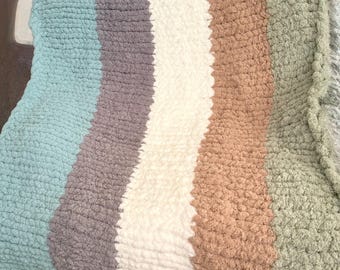 Coperta lavorata a maglia con filato grosso