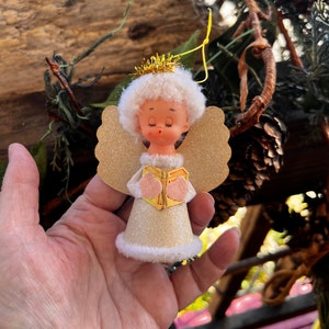 May include: A handmade, wooden cutting board with a natural finish. The board features a live edge on one side and a smooth, rectangular shape. It is approximately 18 inches long and 12 inches wide.