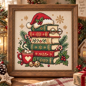 May include: A framed cross-stitch embroidery featuring a stack of red and green books topped with a Santa hat and glasses. Beside the books is a red mug with a white heart, steam, candy canes, holly leaves, berries, and gold jingle bells.