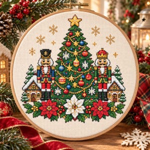May include: A circular embroidery hoop containing a cross-stitch design of a decorated Christmas tree, two nutcrackers, small snow-covered houses, and poinsettia flowers. The tree is adorned with colourful ornaments, gold stars, and snowflakes.